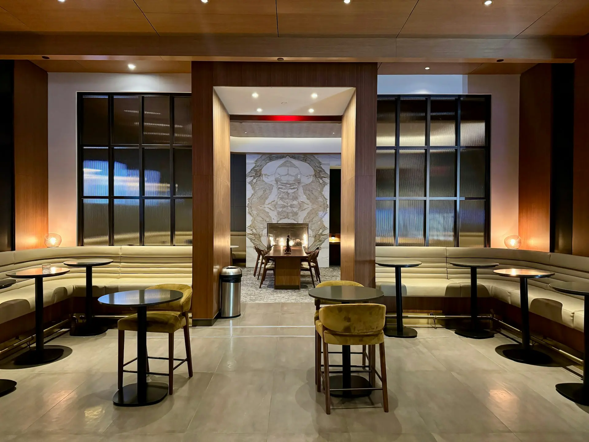 a restaurant with tables, chairs, and benches